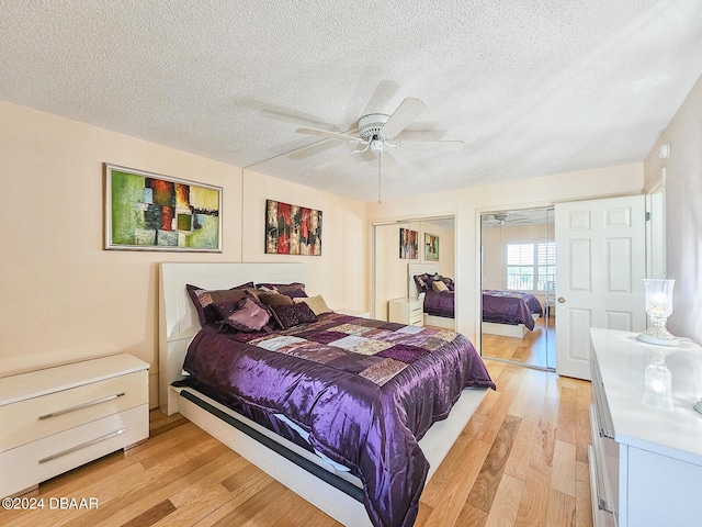 bedroom with light hardwood / wood-style floors, ceiling fan, and a textured ceiling