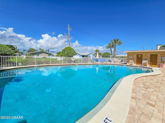 view of swimming pool featuring a patio area