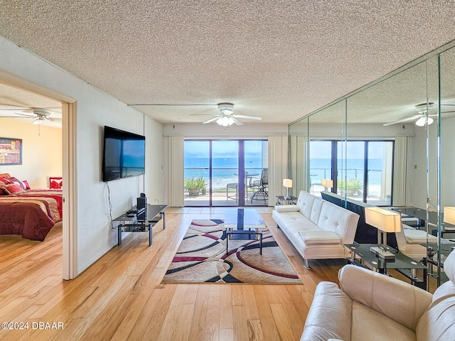 living room featuring hardwood / wood-style flooring and a textured ceiling