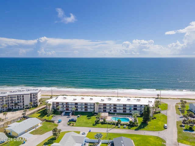 bird's eye view featuring a view of the beach and a water view