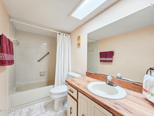 full bathroom featuring vanity, shower / bath combo, tile patterned flooring, toilet, and a skylight