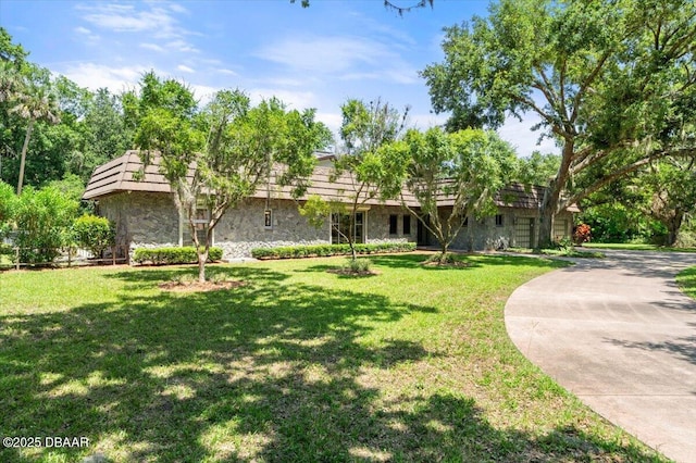 1010/1020 Big Tree Rd, Daytona Beach, FL 32119 - view of front facade featuring stone siding and a front lawn