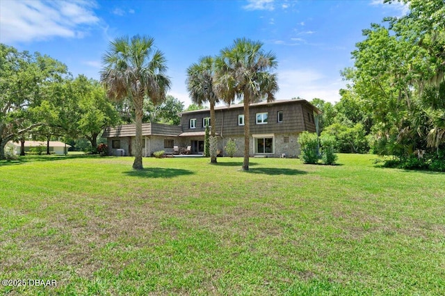 1010/1020 Big Tree Rd, Daytona Beach, FL 32119 - back of house with a lawn