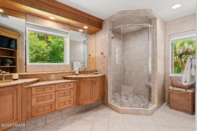 1010/1020 Big Tree Rd, Daytona Beach, FL 32119 - full bath with vanity, a stall shower, tile patterned floors, and tile walls