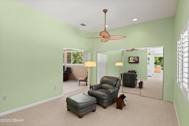 1010/1020 Big Tree Rd, Daytona Beach, FL 32119 - living area with carpet flooring and a ceiling fan
