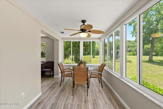 1010/1020 Big Tree Rd, Daytona Beach, FL 32119 - sunroom / solarium with healthy amount of natural light, wood finished floors, and a wooden deck