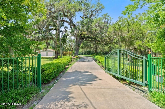 1010/1020 Big Tree Rd, Daytona Beach, FL 32119 - view of property's community with a gate and view of wooded area