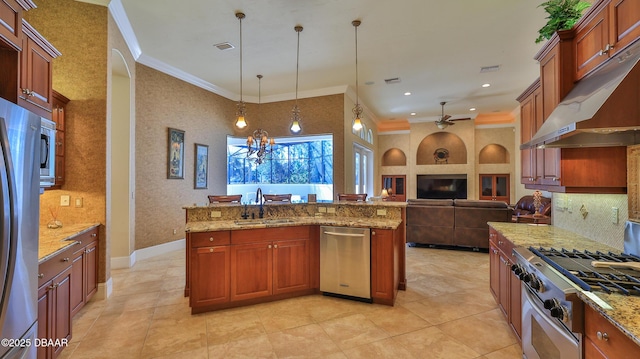 kitchen with crown molding, sink, decorative light fixtures, and appliances with stainless steel finishes