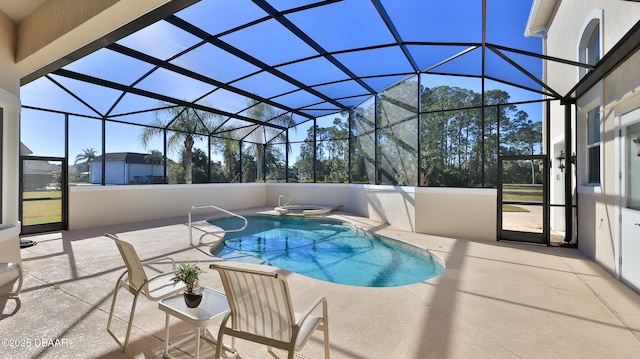 view of swimming pool featuring glass enclosure and a patio area