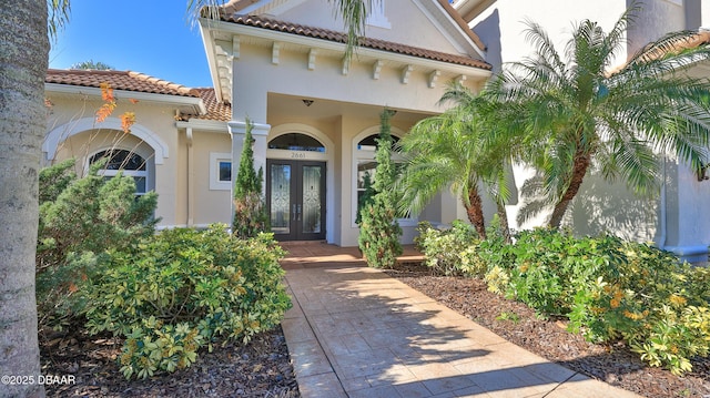 property entrance featuring french doors