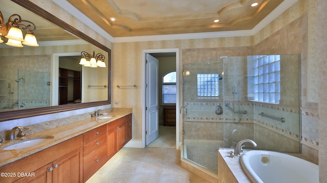 bathroom with a tray ceiling, crown molding, vanity, and separate shower and tub