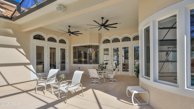 view of patio featuring ceiling fan and french doors