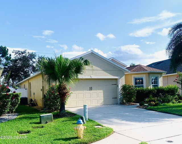 2672 Star Coral Ln, New Smyrna Beach, FL 32168 - single story home with driveway, stucco siding, a front yard, and an attached garage