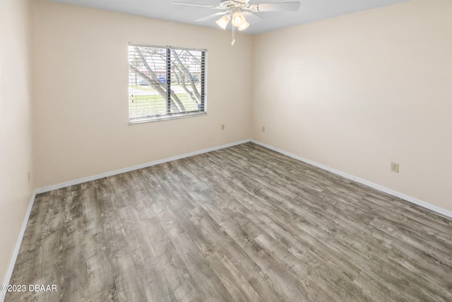 empty room featuring hardwood / wood-style floors and ceiling fan