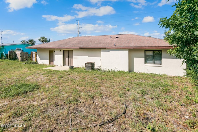 back of property featuring cooling unit