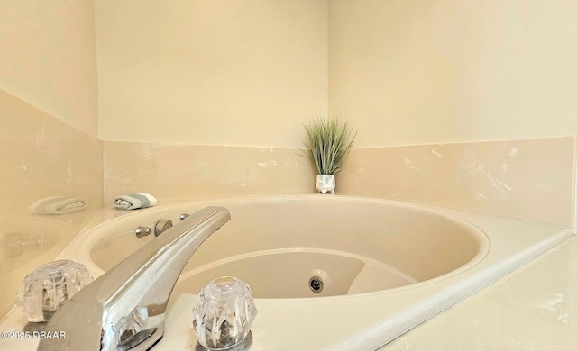 bathroom with a garden tub