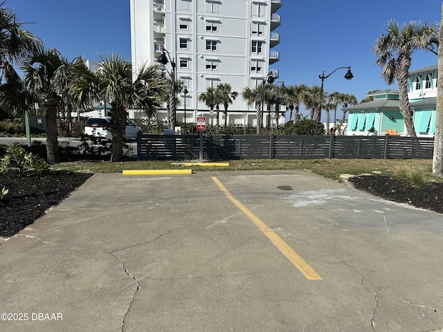 uncovered parking lot with fence