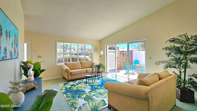 living room with baseboards, carpet floors, and high vaulted ceiling