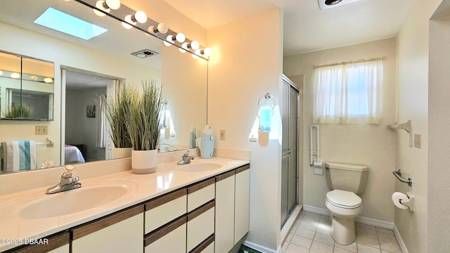 ensuite bathroom featuring a sink, toilet, a stall shower, and ensuite bathroom