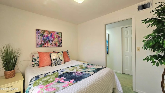 bedroom with baseboards, visible vents, and carpet floors