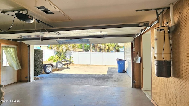 garage with visible vents and a garage door opener