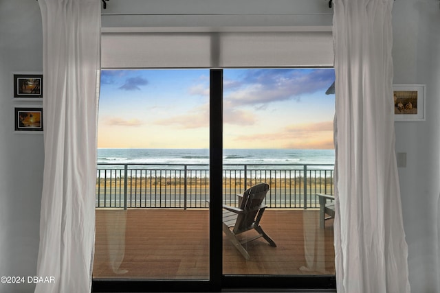 interior space featuring a water view and a view of the beach