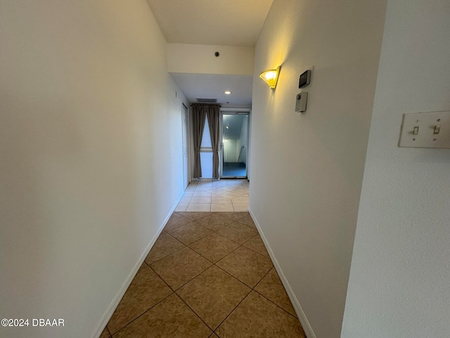 hallway with light tile patterned flooring