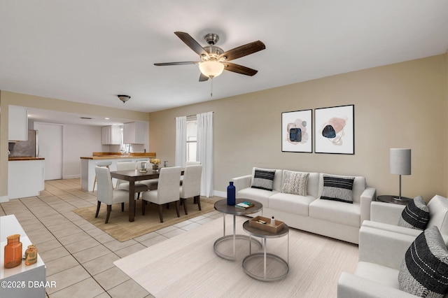 tiled living room featuring ceiling fan