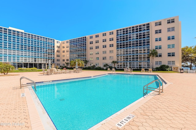 community pool featuring a patio area