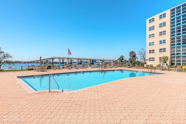 community pool with a patio area