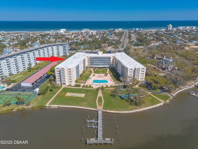 drone / aerial view with a city view and a water view