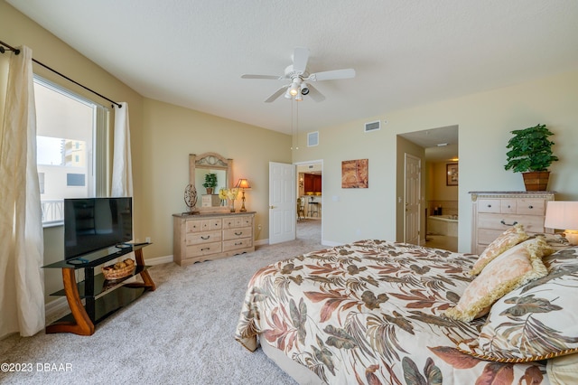 3801 S Atlantic Ave Unit 303, Daytona Beach Shores, FL 32118 - bedroom featuring carpet, baseboards, ceiling fan, ensuite bath, and vaulted ceiling