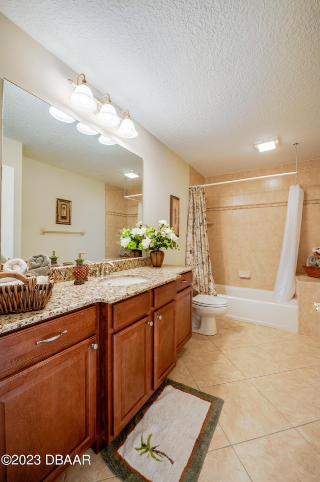 3801 S Atlantic Ave Unit 303, Daytona Beach Shores, FL 32118 - full bath with vanity, a textured ceiling, tile patterned floors, toilet, and shower / bath combo with shower curtain
