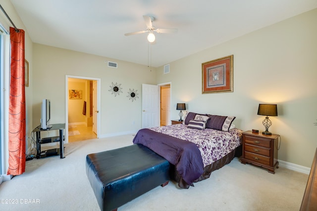 3801 S Atlantic Ave Unit 303, Daytona Beach Shores, FL 32118 - bedroom with light carpet, baseboards, ensuite bathroom, and ceiling fan