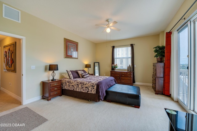 3801 S Atlantic Ave Unit 303, Daytona Beach Shores, FL 32118 - bedroom with light colored carpet, baseboards, and a ceiling fan