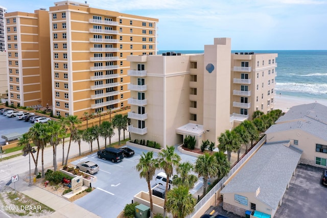 3801 S Atlantic Ave Unit 303, Daytona Beach Shores, FL 32118 - view of apartment building / complex with uncovered parking and a water view