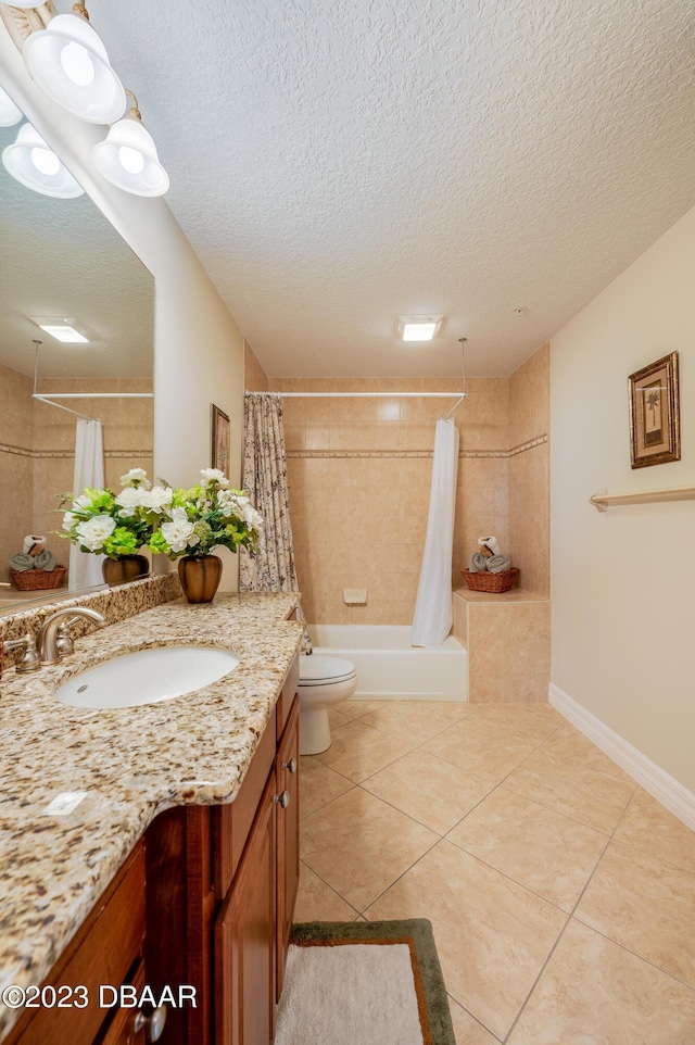 3801 S Atlantic Ave Unit 303, Daytona Beach Shores, FL 32118 - full bathroom with tile patterned flooring, vanity, toilet, a textured ceiling, and shower / bath combination with curtain