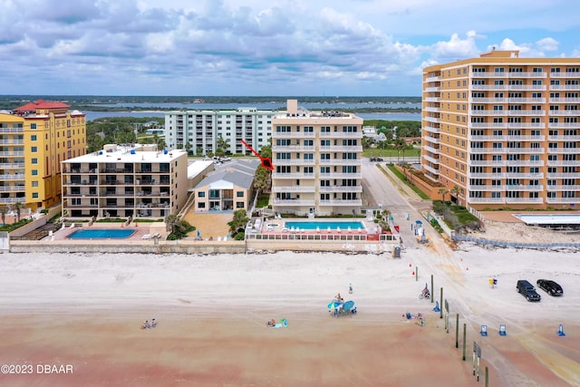 3801 S Atlantic Ave Unit 303, Daytona Beach Shores, FL 32118 - aerial view of a pool area, a large body of water, and apartment complex