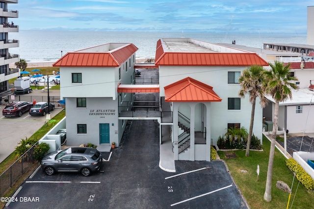 view of building exterior with a water view