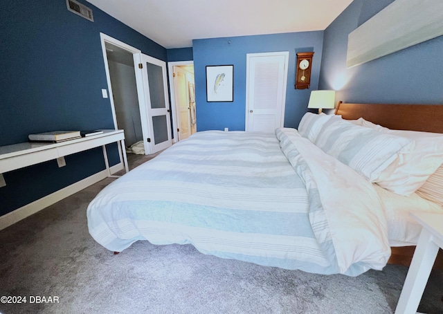 carpeted bedroom with a closet