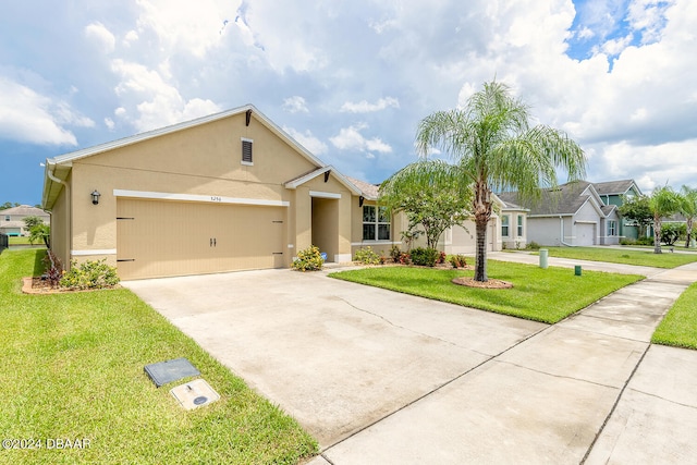 view of front facade featuring a garage and a front yard