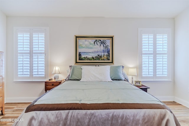 bedroom with light wood-type flooring