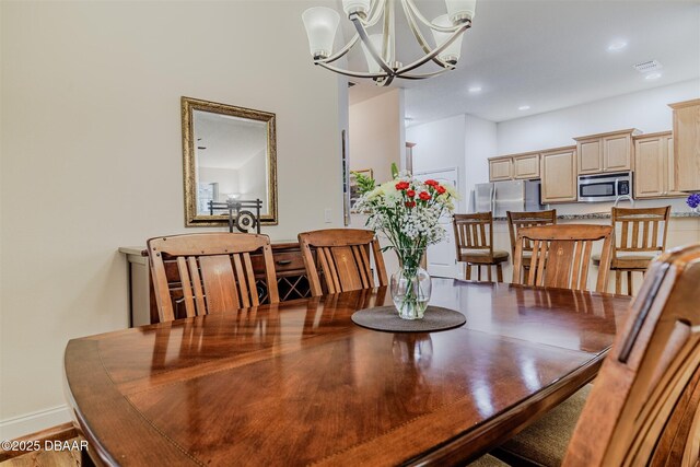 dining area with a chandelier