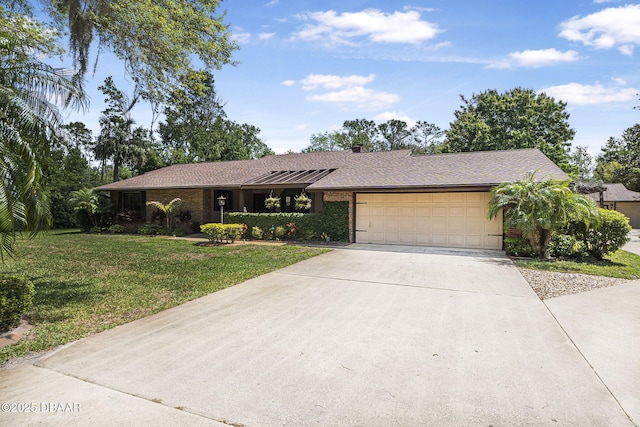 229 Riverbend Rd, Ormond Beach, FL 32174 - ranch-style house featuring a garage, driveway, a front yard, and brick siding