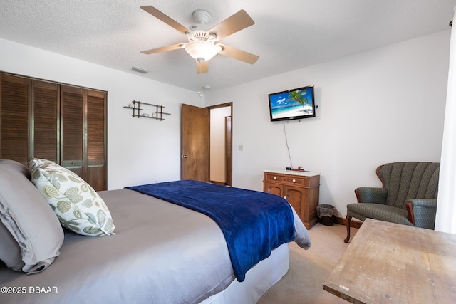 229 Riverbend Rd, Ormond Beach, FL 32174 - carpeted bedroom with a closet and ceiling fan