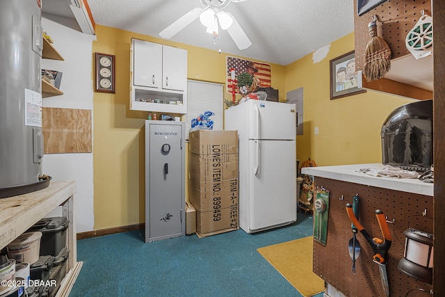 229 Riverbend Rd, Ormond Beach, FL 32174 - kitchen with freestanding refrigerator, white cabinets, a ceiling fan, carpet, and a textured ceiling