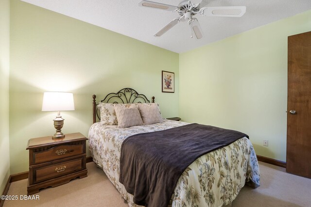 229 Riverbend Rd, Ormond Beach, FL 32174 - carpeted bedroom with baseboards and a ceiling fan