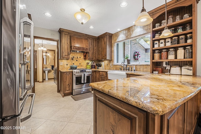 229 Riverbend Rd, Ormond Beach, FL 32174 - kitchen featuring stainless steel appliances, custom range hood, a peninsula, a sink, and open shelves