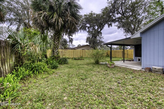 view of yard with a patio and a fenced backyard