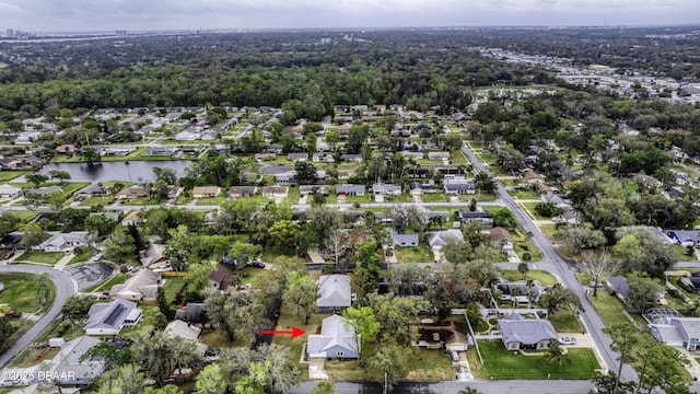 bird's eye view featuring a residential view and a water view